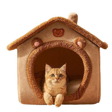 A plush pet bed shaped like a small house